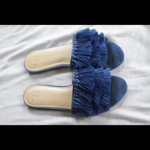Blue fringe flip flops
